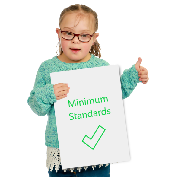little girl holding a piece of paper which says minimum standards.